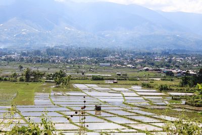 High angle view of field against mountains
