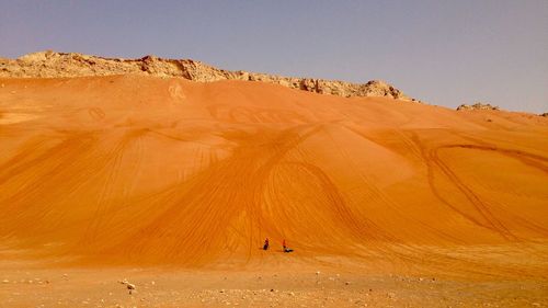 Scenic view of desert against clear sky