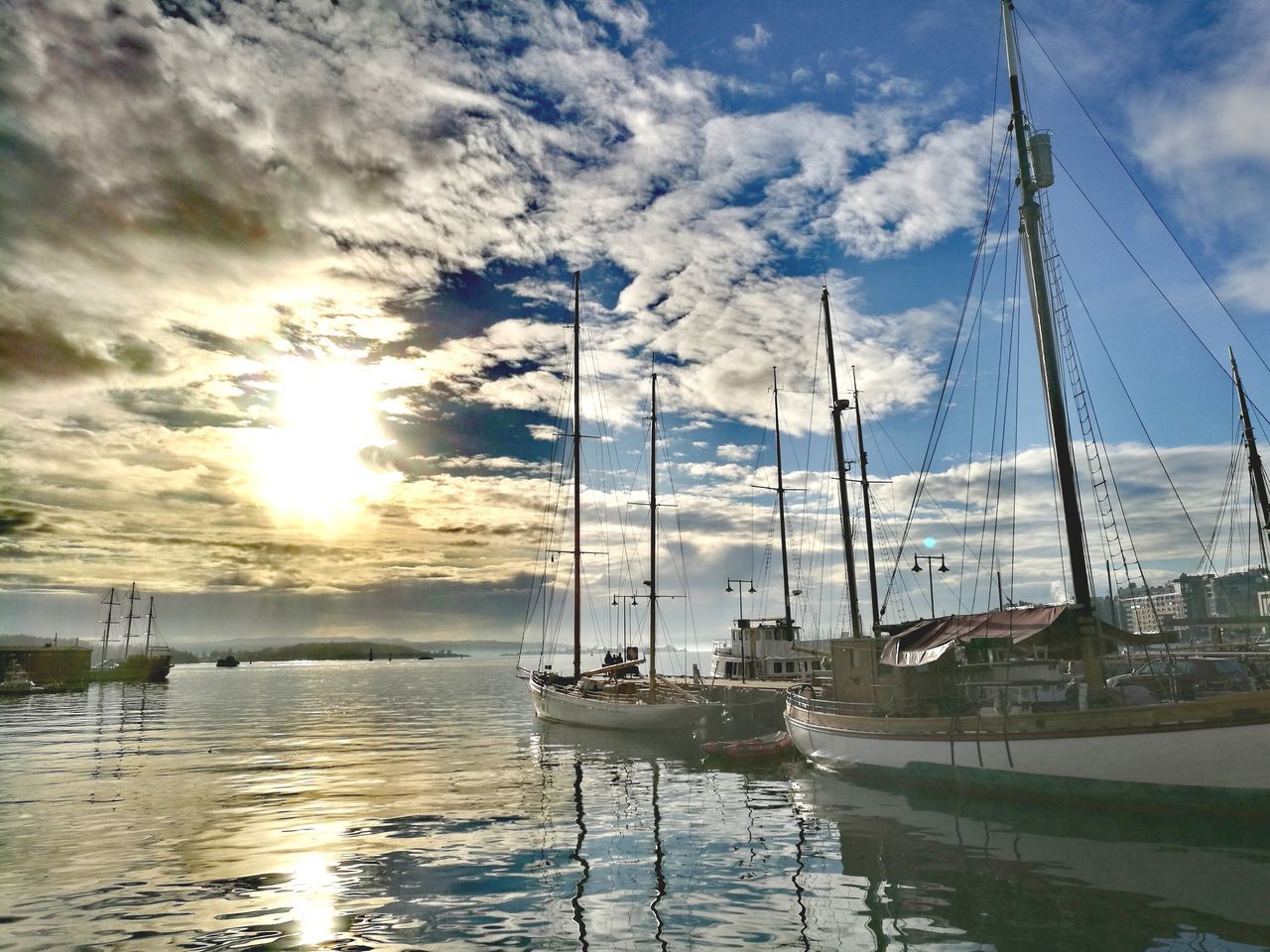 nautical vessel, transportation, mode of transport, mast, cloud - sky, sky, water, moored, reflection, sailboat, boat, nature, waterfront, harbor, no people, tranquility, scenics, outdoors, yacht, beauty in nature, sunset, sailing, sea, day, travel destinations, tall ship, sailing ship