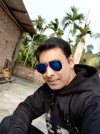 Portrait of young man wearing sunglasses