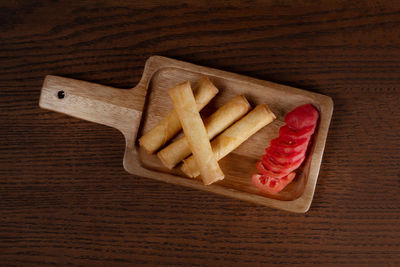High angle view of bread on cutting board