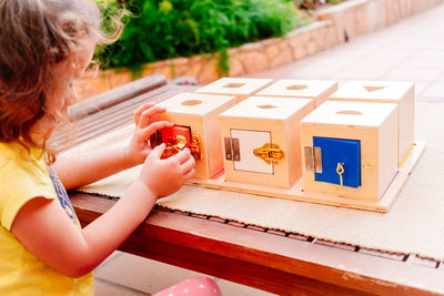 Wooden boxes with locks, educational montessori material to manipulate objects by children