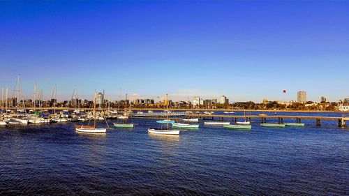 Boats moored at harbor