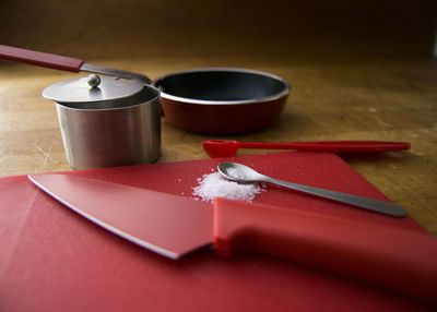 Close-up of spoon and knife on table