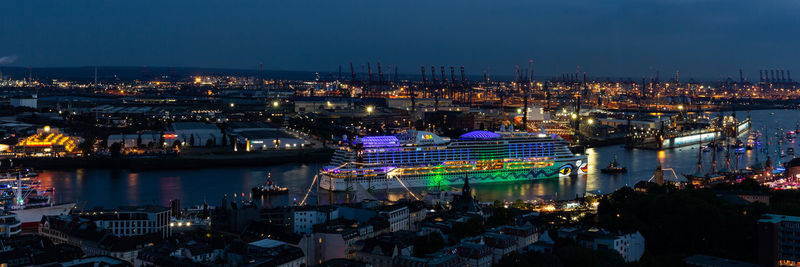 High angle view of illuminated city buildings at night