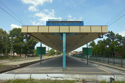 Road by city against sky