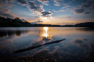 Scenic view of lake against sky during sunset