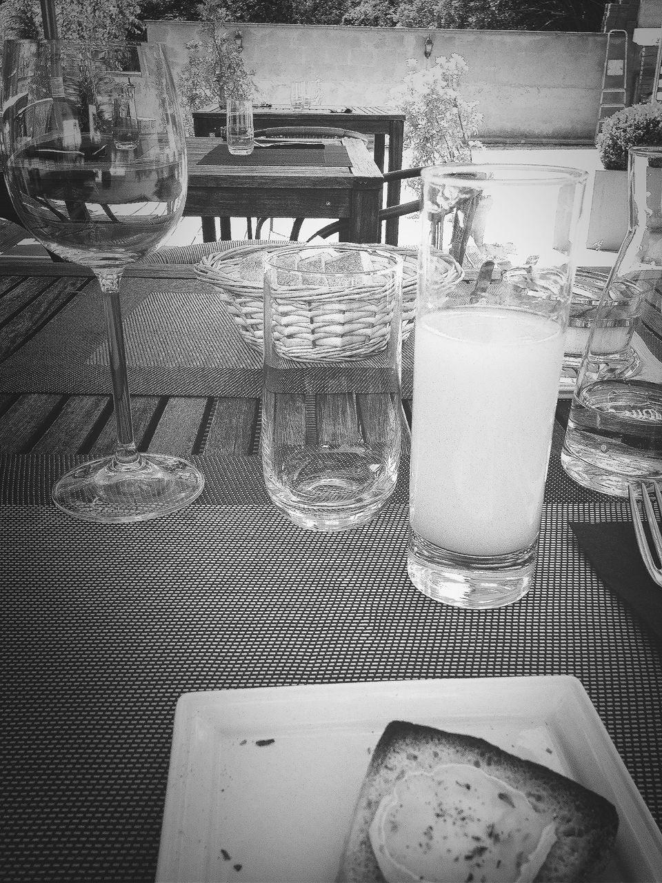 indoors, glass - material, table, food and drink, high angle view, still life, transparent, close-up, drink, drinking glass, chair, no people, window, day, freshness, glass, refreshment, restaurant, sunlight, home interior