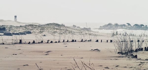 Scenic view of snow covered mountains against clear sky