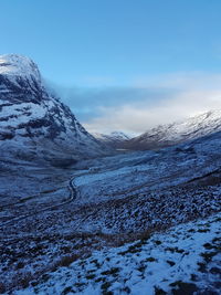 Scenic view of snowcapped mountains against sky