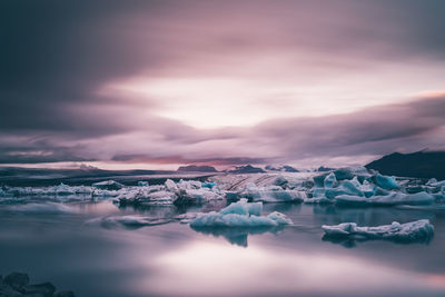 Scenic view of sea against dramatic sky