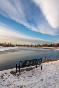 Scenic view of lake against sky during winter
