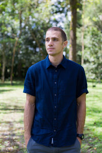 Portrait of man standing on grass