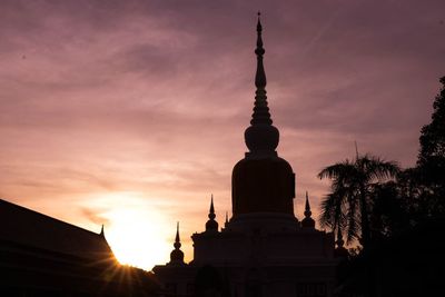 Low angle view of silhouette building against sky during sunset