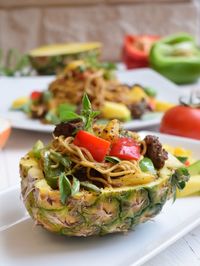 Hawaian pasta spagetti served in the pineapple