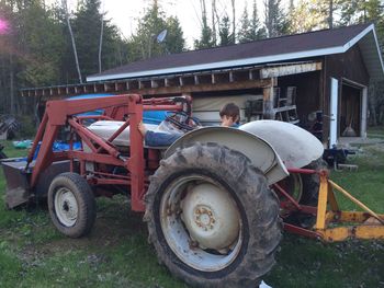 Close-up of tractor against trees