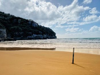 Scenic view of beach against sky