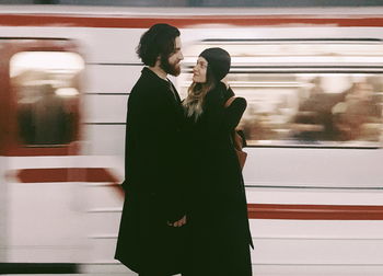 Shadow of people on train at railroad station