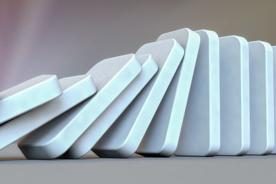 Close-up of papers on table against white background