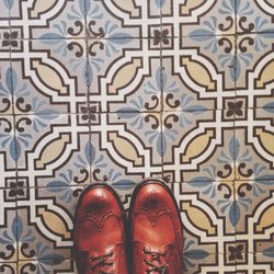 Leather shoes against designed flooring