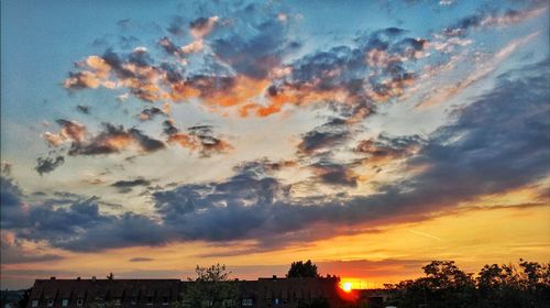 Low angle view of dramatic sky during sunset