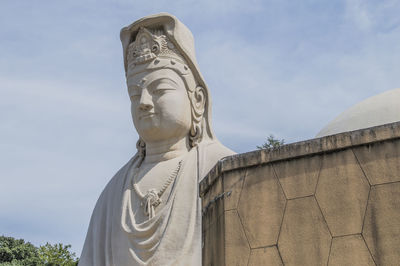 Low angle view of statue against sky