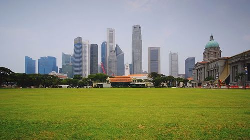 Singapore cricket assn by modern buildings against sky