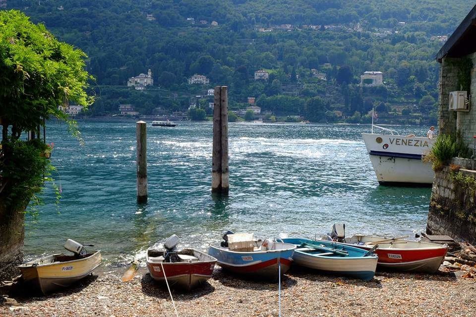 BOATS IN LAKE AGAINST SKY