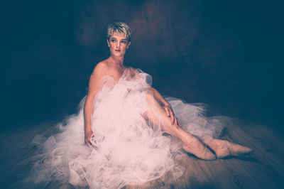 Young woman against gray background