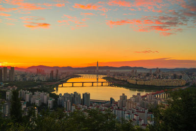 High angle view of buildings against sky during sunset