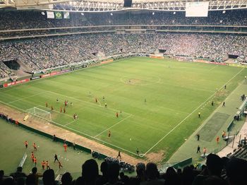 High angle view of people playing soccer field