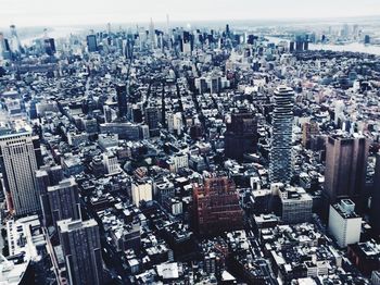 High angle view of modern buildings in city against sky