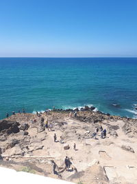 Scenic view of sea against clear blue sky