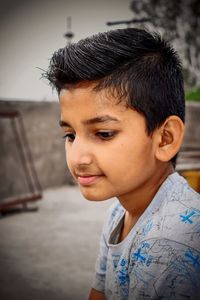 Close-up portrait of boy looking away