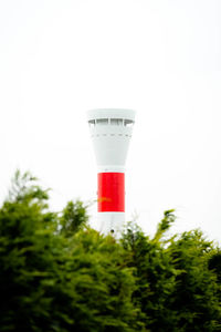 Low angle view of red wine glass against sky