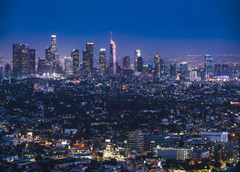 Illuminated buildings in city at night