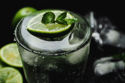 Close-up of lime in glass of water