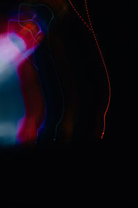 Close-up of light painting against black background