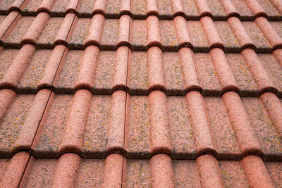 New roof with ceramic tiles close-up. roofing tiles