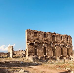 Old ruin building against blue sky