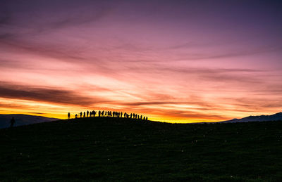 Scenic view of landscape against sky during sunset