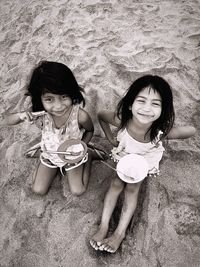 High angle portrait of happy girl on beach