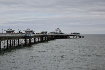 Pier on sea against sky