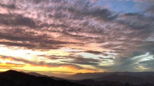 Scenic view of dramatic sky during sunset