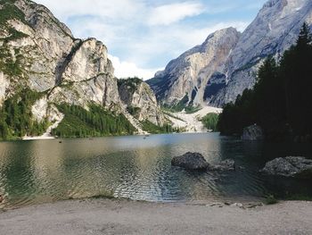 Scenic view of lake and mountains against sky