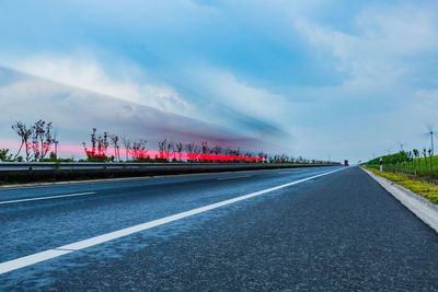 Road by highway against sky