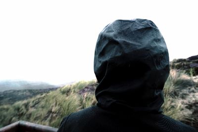 Rear view of man against sky