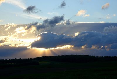 Scenic view of field against sky during sunset