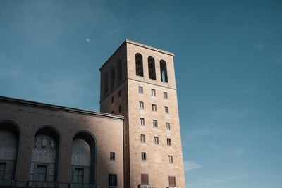 Low angle view of building against blue sky