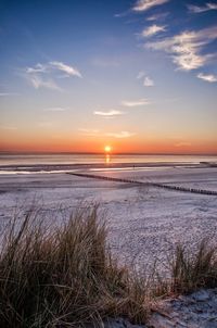 Scenic view of sea at sunset